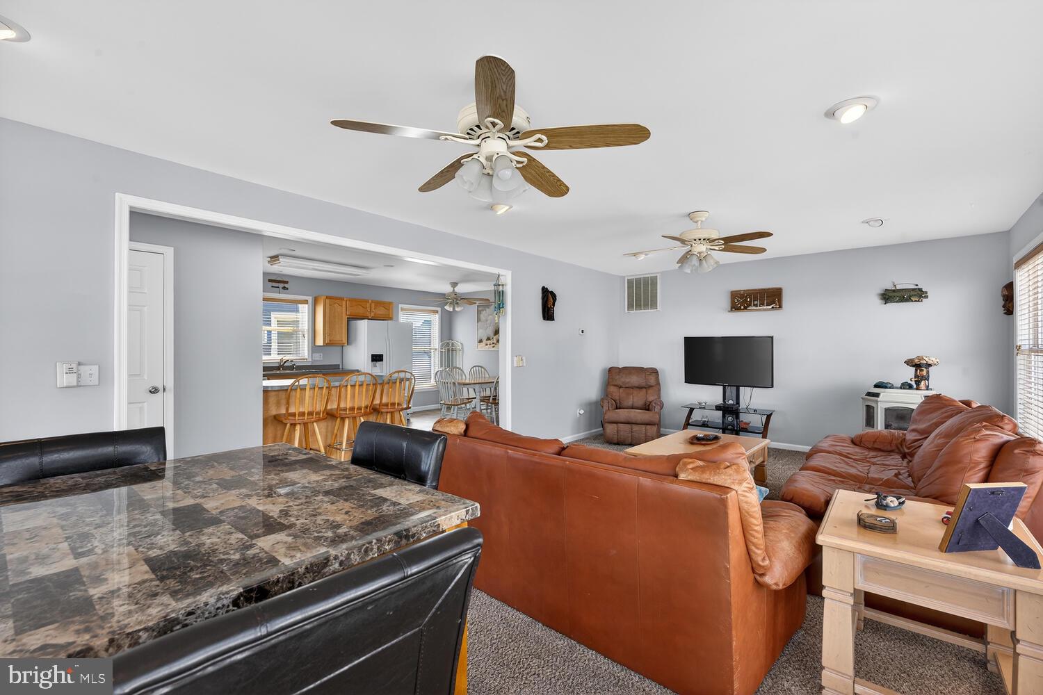 4376 South Bowers Road Milford, DE 19963 - Photo 17 of 46 a living room with furniture and a window