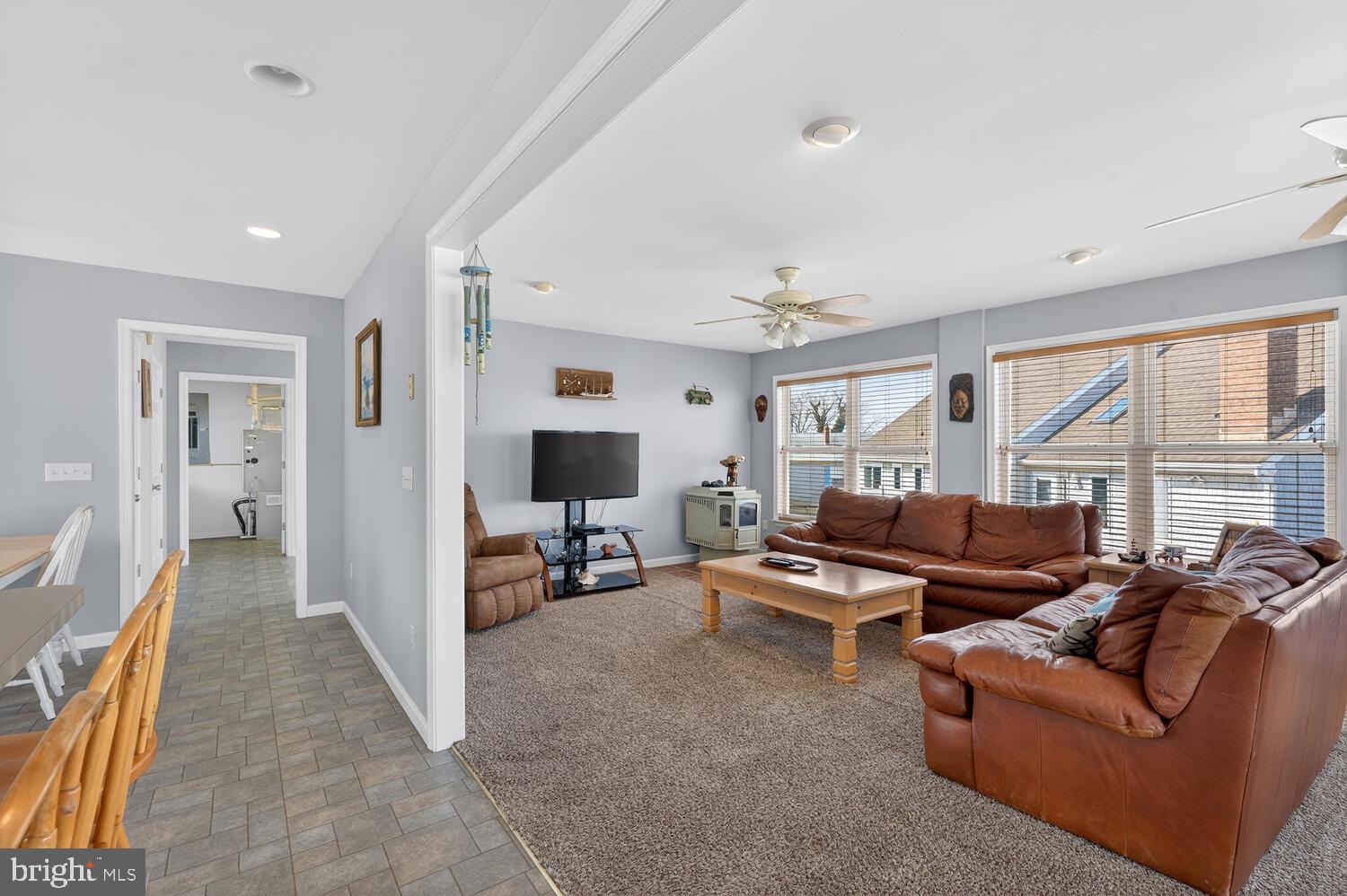 4376 South Bowers Road Milford, DE 19963 - Photo 19 of 46 a living room with furniture and a flat screen tv