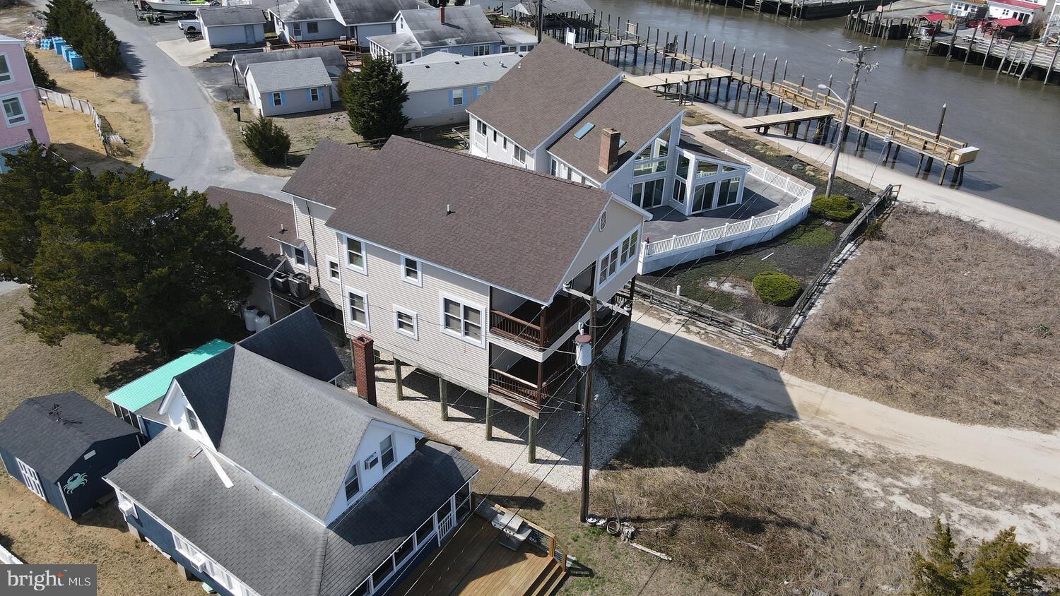 4376 South Bowers Road Milford, DE 19963 - Photo 2 of 46 an aerial view of a house with outdoor space and a lake view