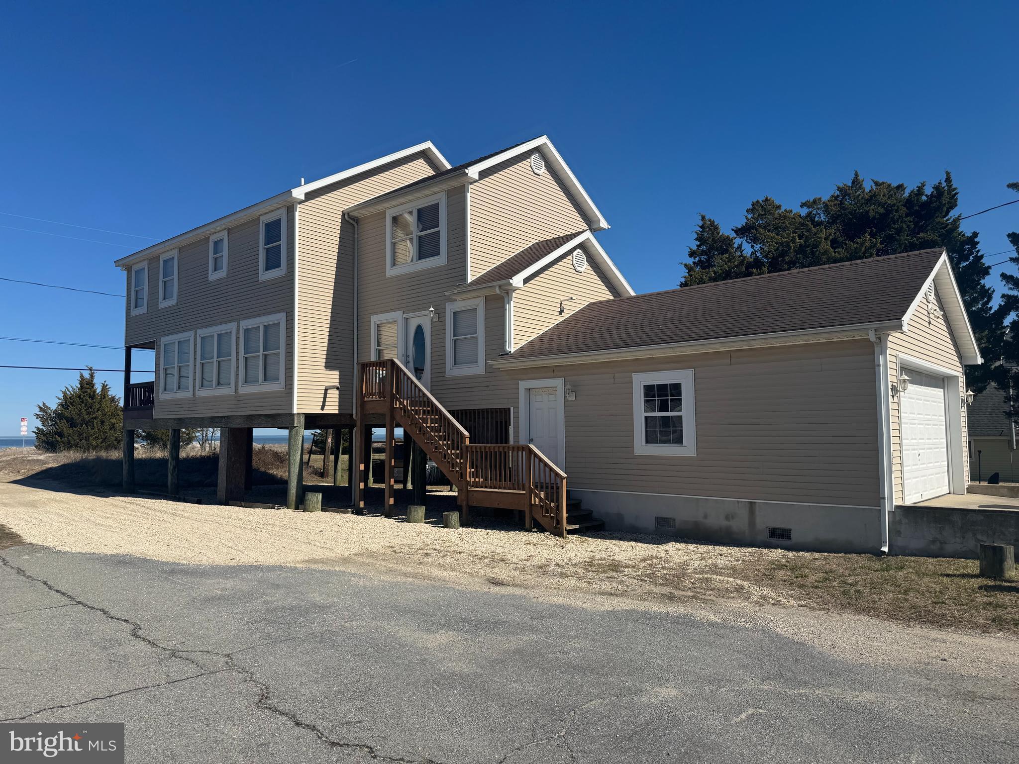 4376 South Bowers Road Milford, DE 19963 - Photo 3 of 46 a front view of a house with a yard