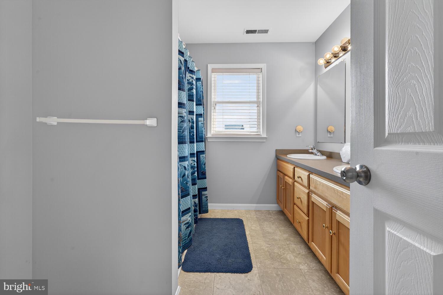 4376 South Bowers Road Milford, DE 19963 - Photo 33 of 46 a hallway with a window and a kitchen
