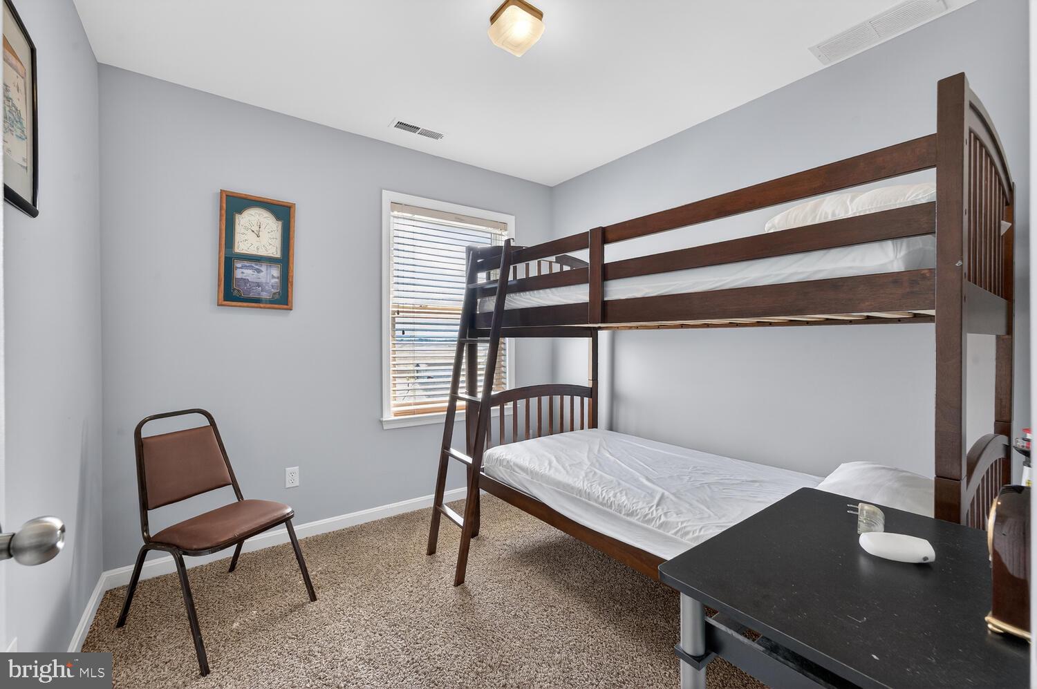 4376 South Bowers Road Milford, DE 19963 - Photo 36 of 46 a bedroom with a bed and a desk