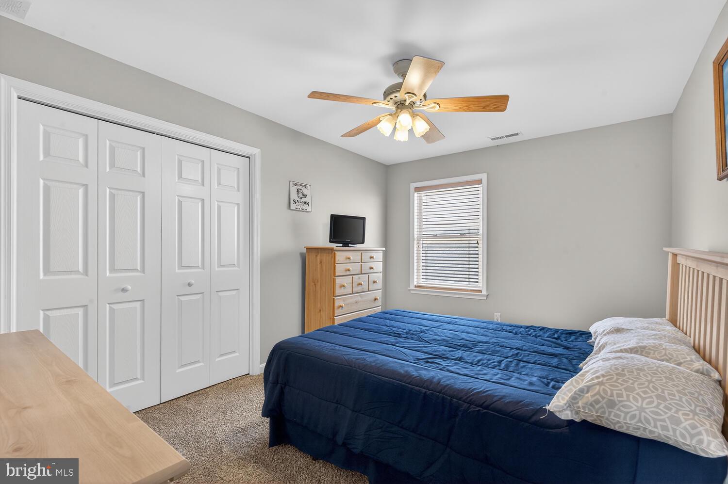 4376 South Bowers Road Milford, DE 19963 - Photo 37 of 46 a bedroom with a bed and a chandelier
