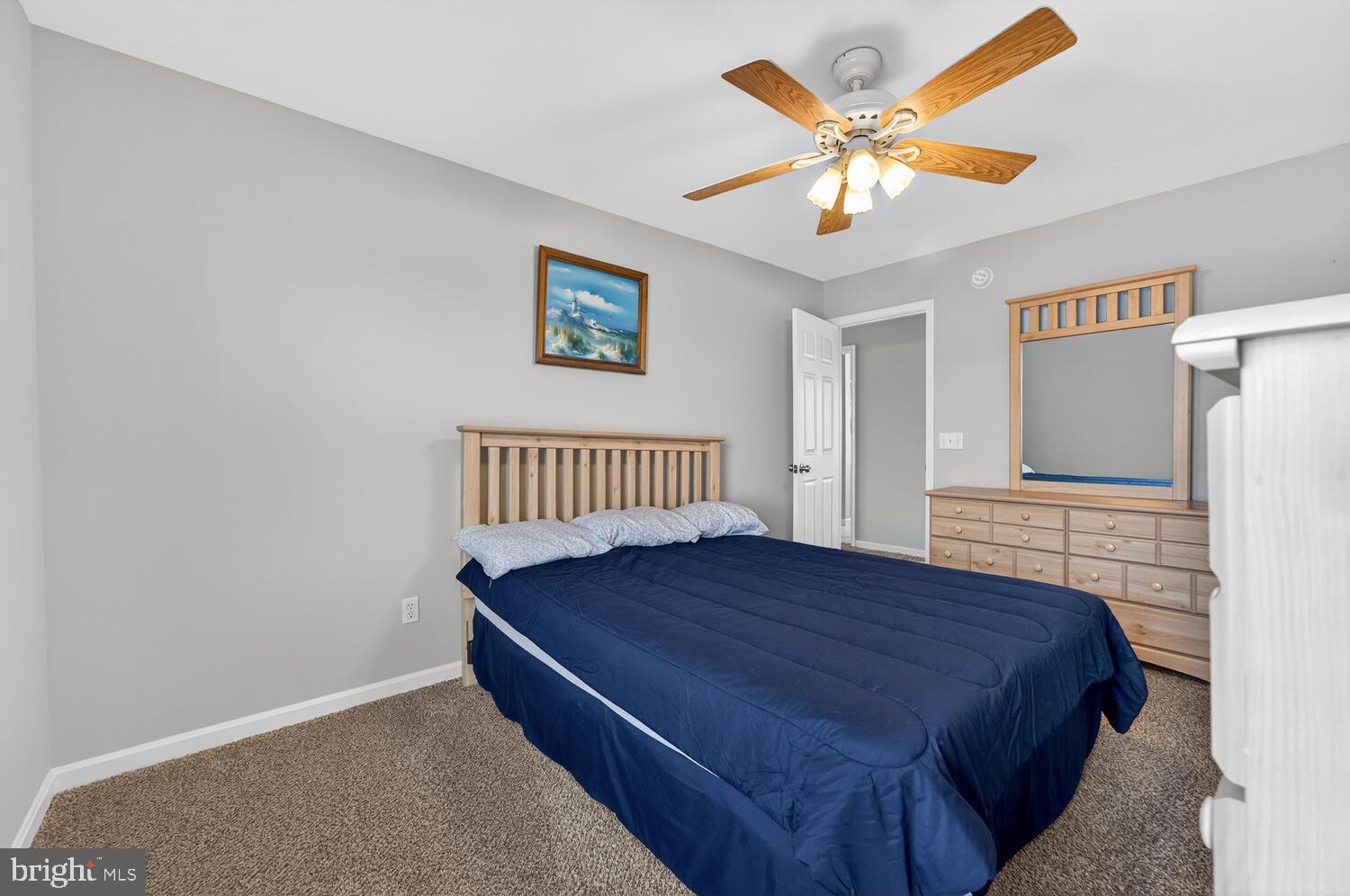 4376 South Bowers Road Milford, DE 19963 - Photo 38 of 46 a bedroom with a bed and a chandelier