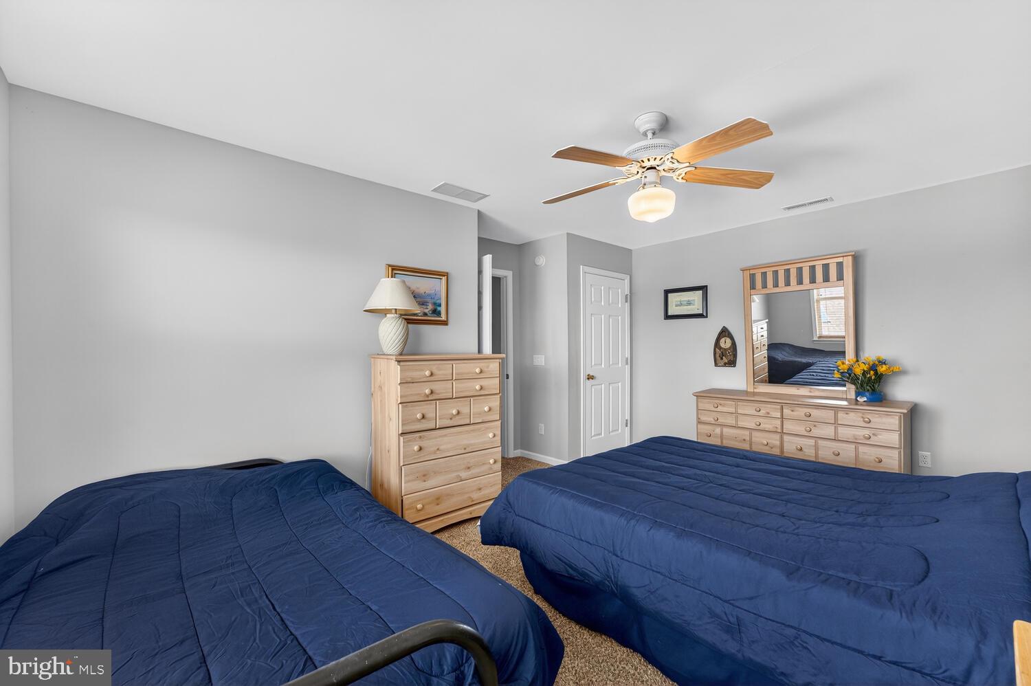 4376 South Bowers Road Milford, DE 19963 - Photo 40 of 46 a bedroom with a bed and a table in it