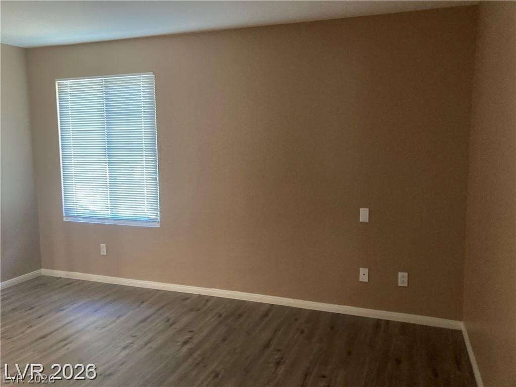 3145 East Flamingo Road, Unit 2100 Las Vegas, NV 89121 - Photo 18 of 34 A well-maintained living area showcases neutral wall tones and practical window treatments.