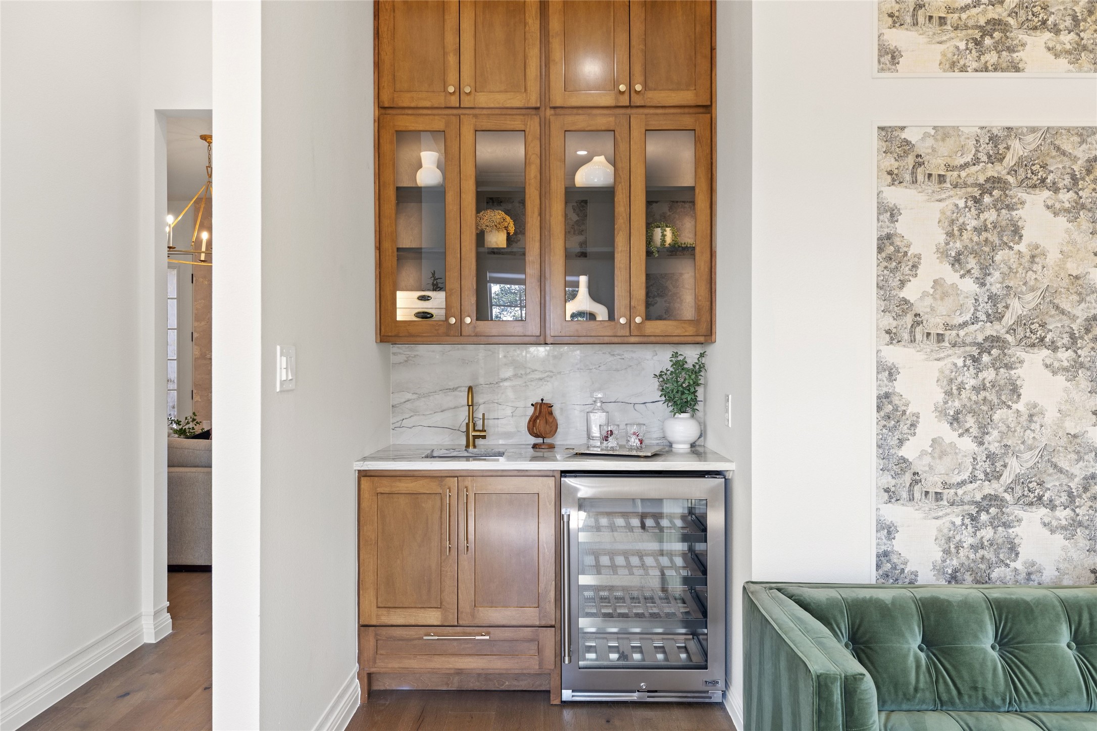 601 Hays Country Acres Road Dripping Springs, TX 78620 - Photo 23 of 38 A built-in wet bar features classic wood cabinetry and a dedicated wine refrigerator.