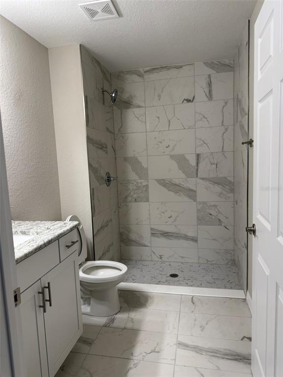 9539 North Travis Drive, Unit B Citrus Springs, FL 34434 - Photo 8 of 11 a bathroom with a shower and a toilet