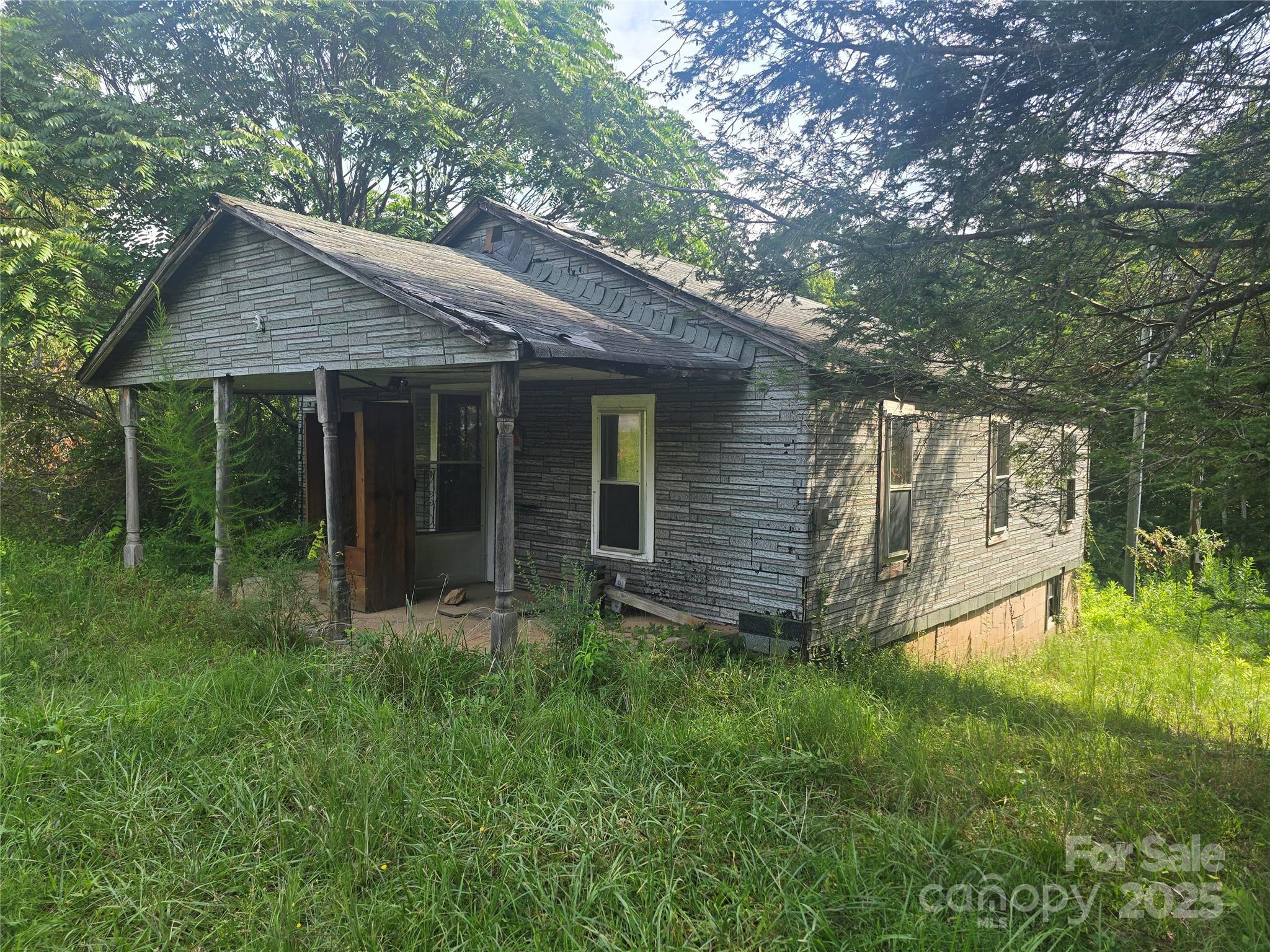 3132 Jones Wade Road Hudson, NC 28638 - Photo 1 of 14 a view of barn with a yard potted plants and large tree