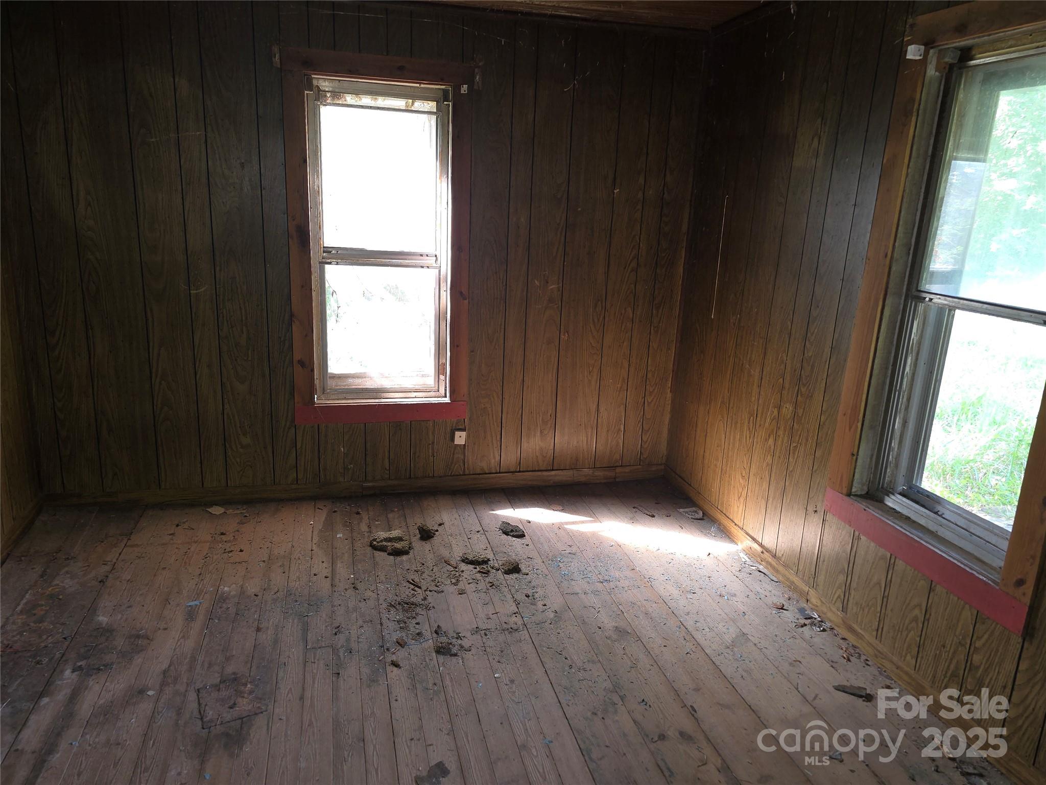 3132 Jones Wade Road Hudson, NC 28638 - Photo 12 of 14 a view of an empty room with wooden floor and a window
