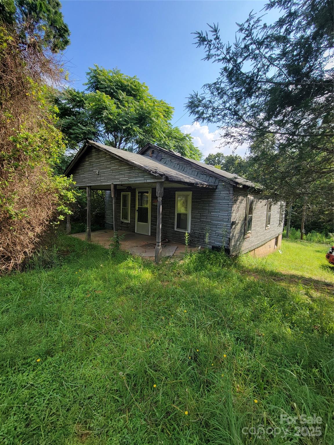 3132 Jones Wade Road Hudson, NC 28638 - Photo 2 of 14 a view of a house with a yard potted plants and large tree