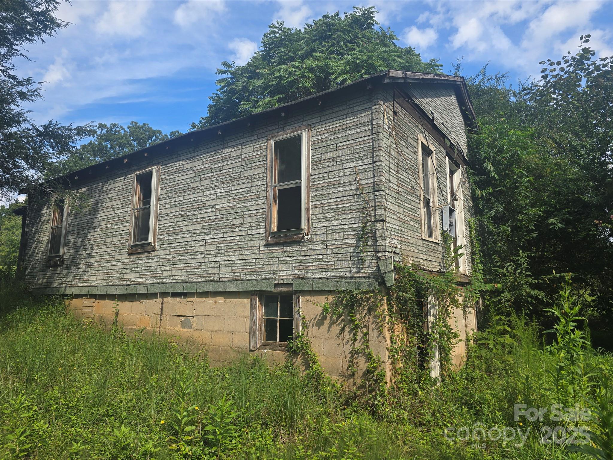 3132 Jones Wade Road Hudson, NC 28638 - Photo 3 of 14 a backyard of a house with lots of green space