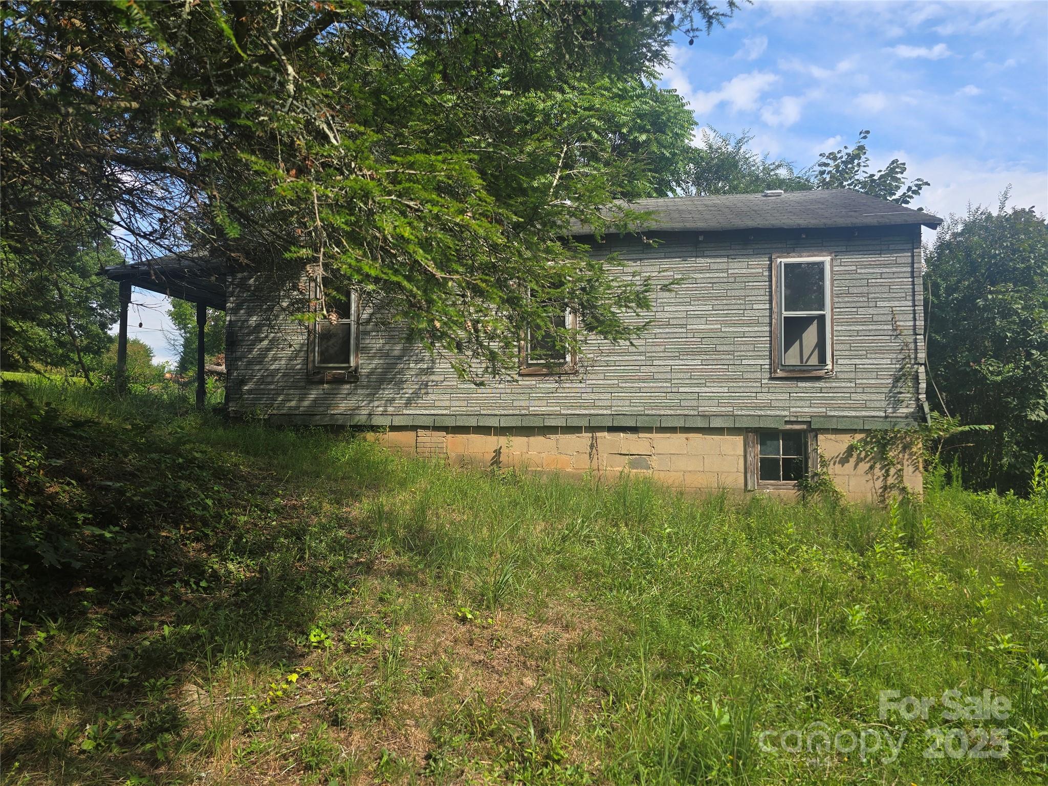 3132 Jones Wade Road Hudson, NC 28638 - Photo 4 of 14 a view of a house with a yard