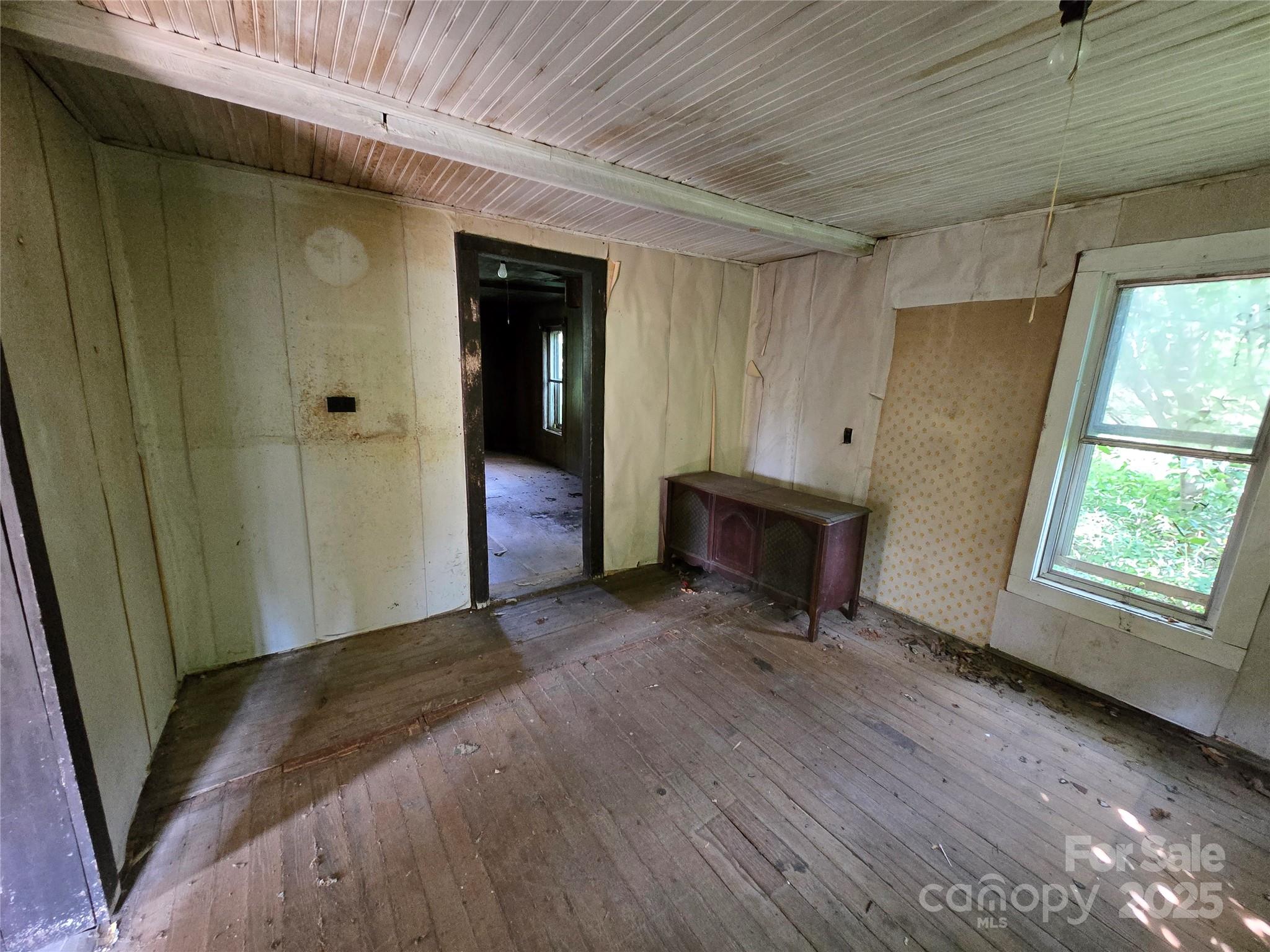 3132 Jones Wade Road Hudson, NC 28638 - Photo 6 of 14 a view of a room with wooden floor and windows