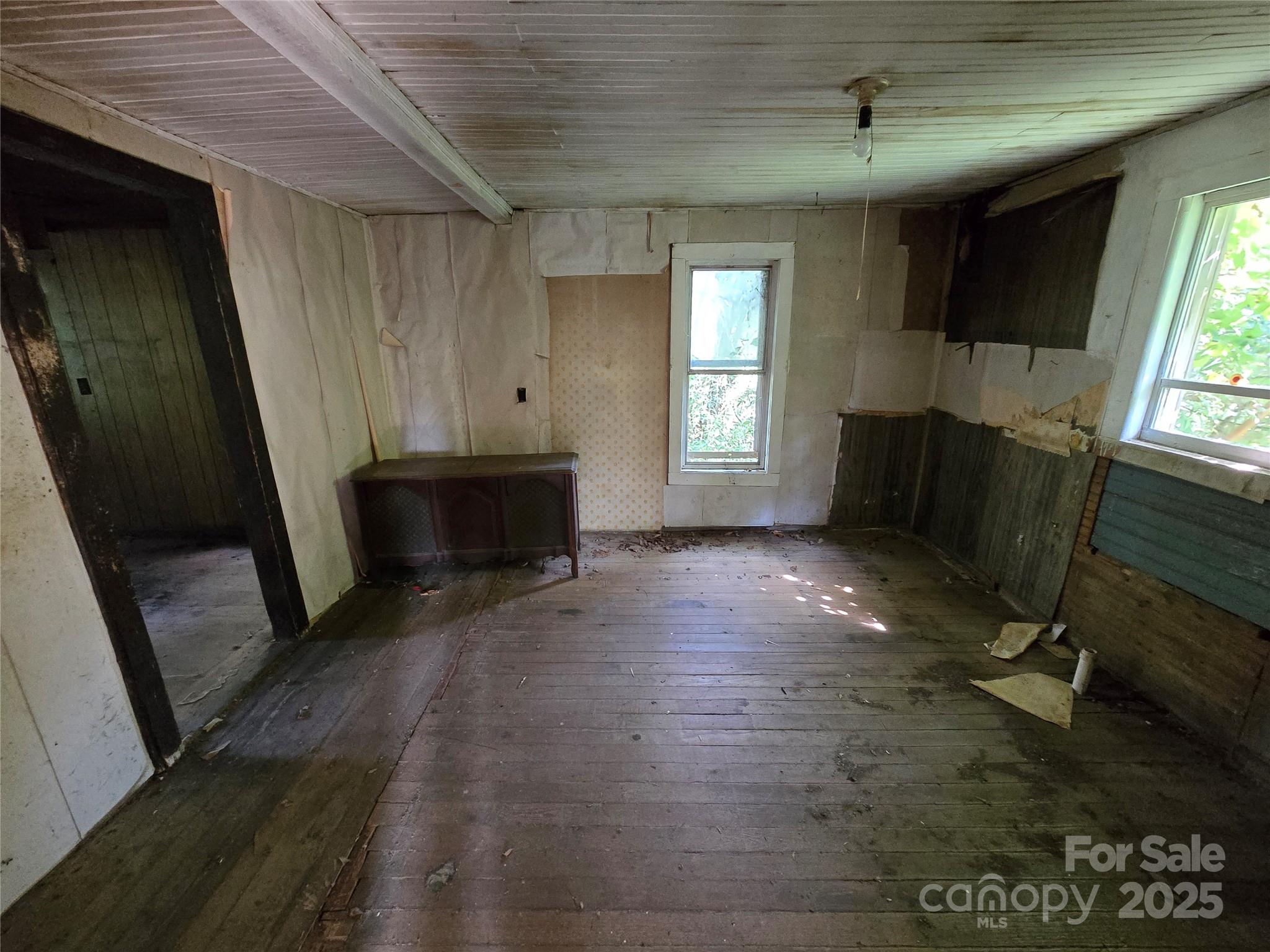 3132 Jones Wade Road Hudson, NC 28638 - Photo 7 of 14 a view of livingroom with furniture window and wooden floor