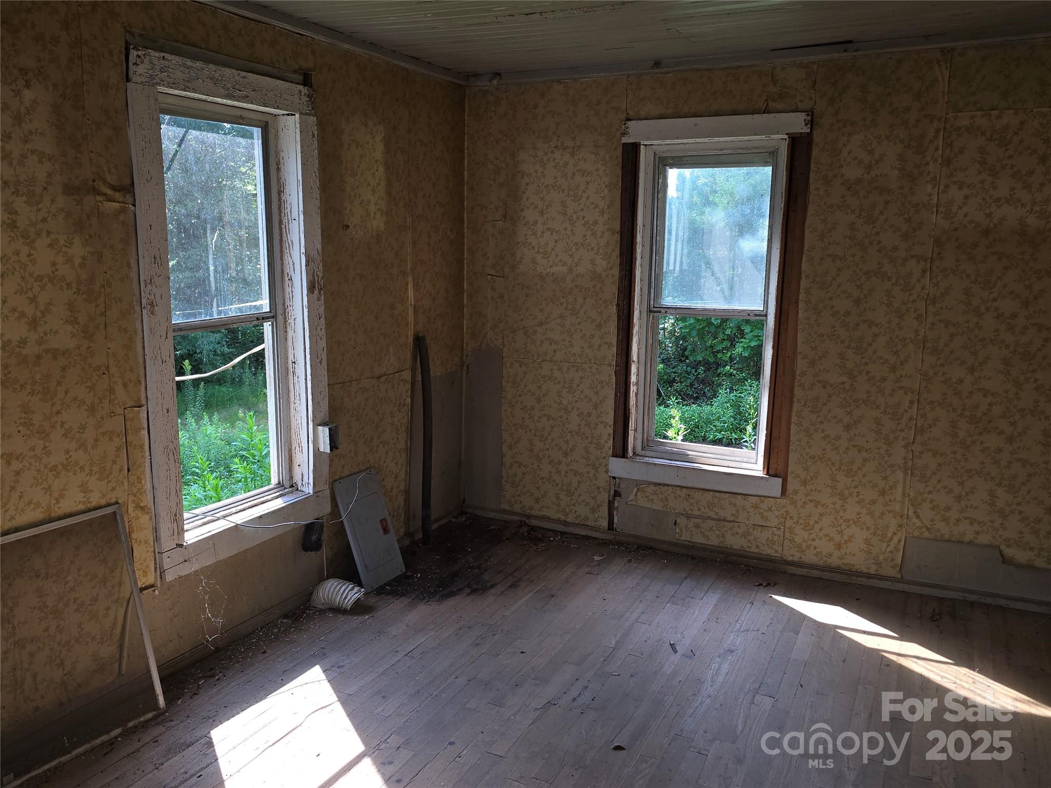 3132 Jones Wade Road Hudson, NC 28638 - Photo 8 of 14 an empty room with wooden floor and windows