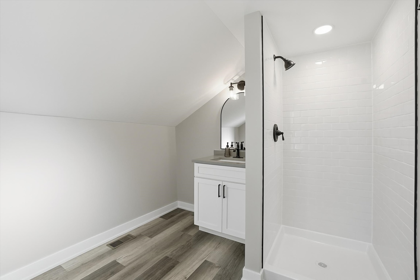 1313 Elizabeth Street Joliet, IL 60435 - Photo 17 of 27 a bathroom with a sink and mirror