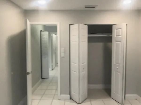 a view of a bathroom with a glass door shower