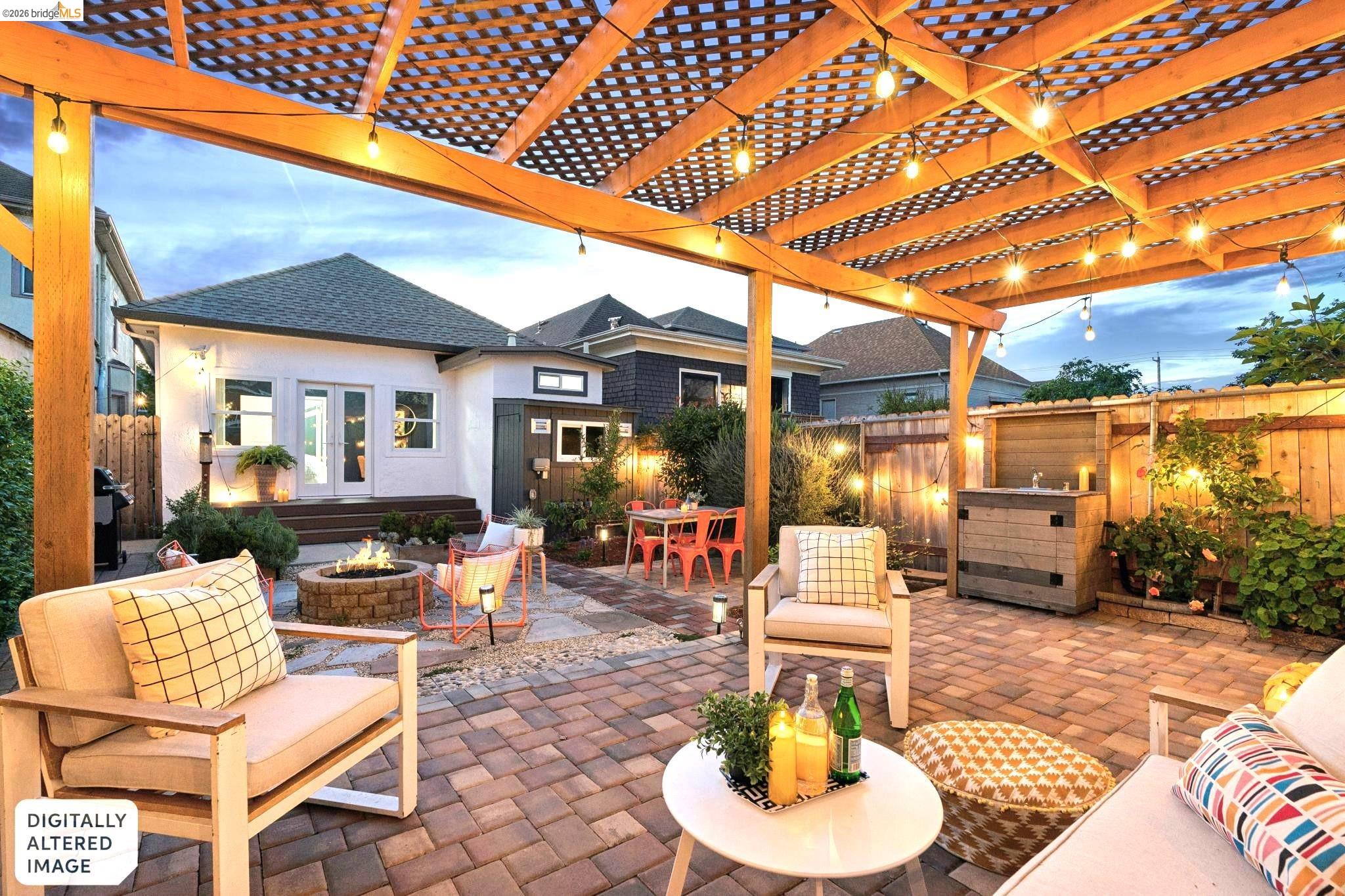 Fenced backyard featuring a patio, an outdoor fire pit, outdoor dining space, and a pergola