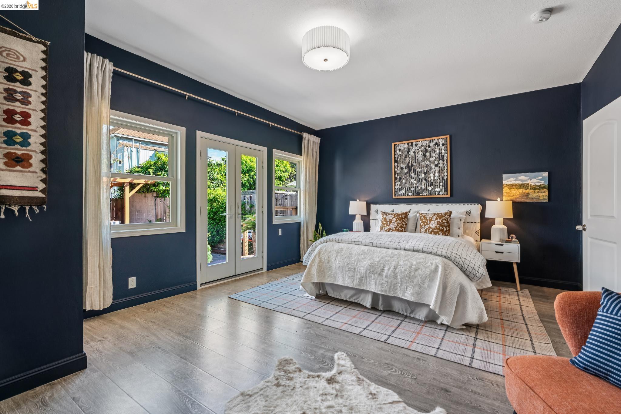2010 Filbert Street Oakland, CA 94607 - Photo 11 of 50 Bedroom with access to exterior, french doors, and light wood finished floors
