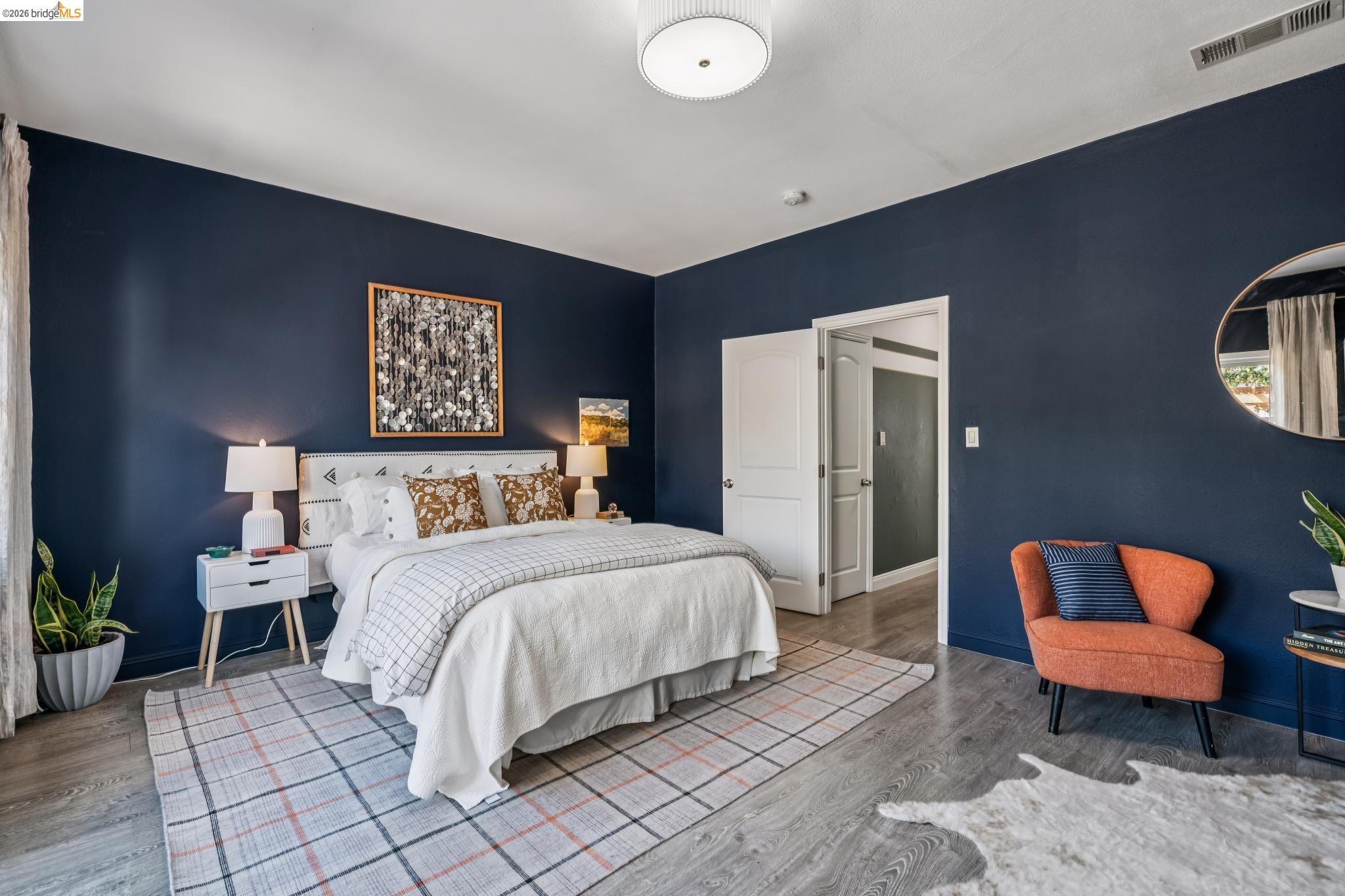 2010 Filbert Street Oakland, CA 94607 - Photo 14 of 50 Bedroom featuring wood finished floors and baseboards