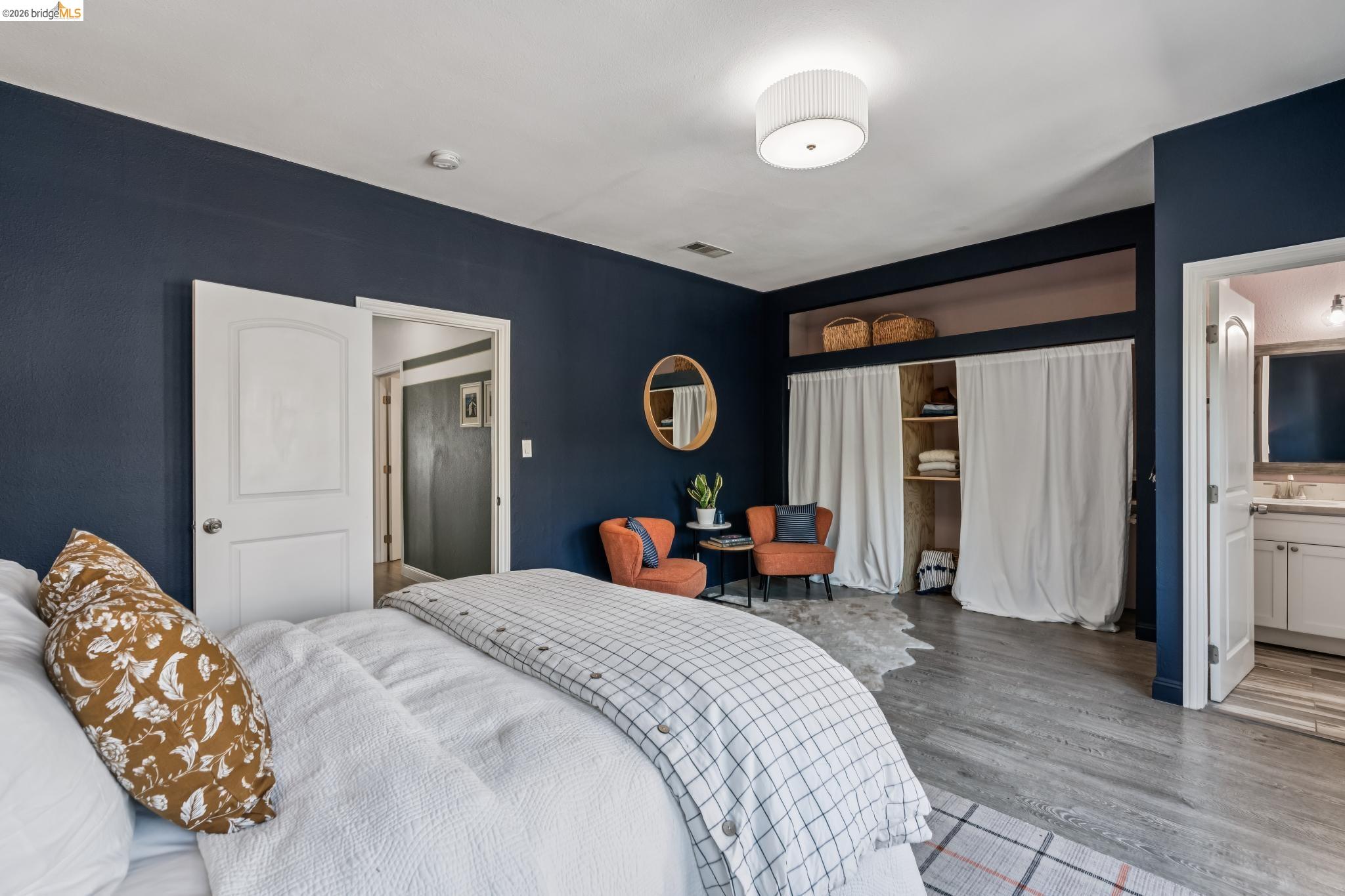 2010 Filbert Street Oakland, CA 94607 - Photo 15 of 50 Bedroom featuring wood finished floors and ensuite bathroom