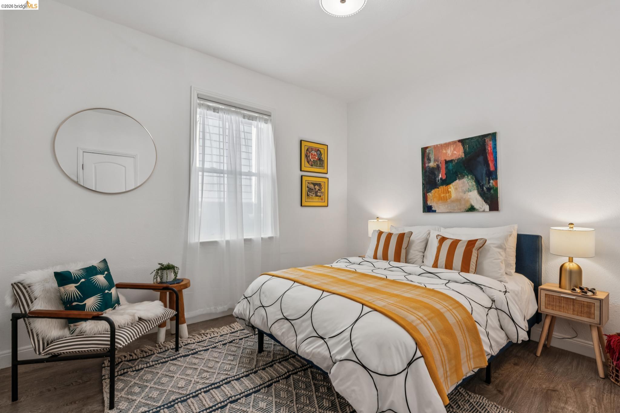 2010 Filbert Street Oakland, CA 94607 - Photo 19 of 50 Bedroom with dark wood finished floors and baseboards