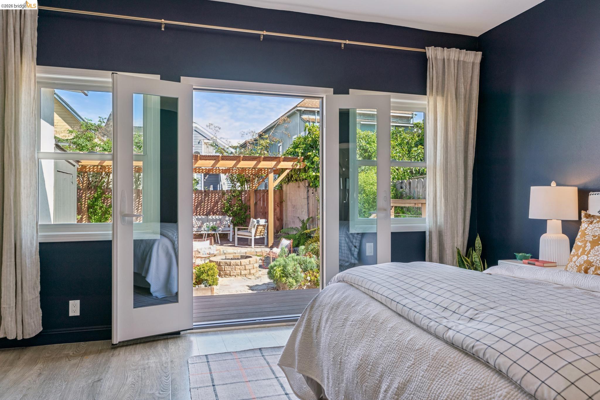2010 Filbert Street Oakland, CA 94607 - Photo 2 of 50 Bedroom with light wood-style flooring and access to exterior