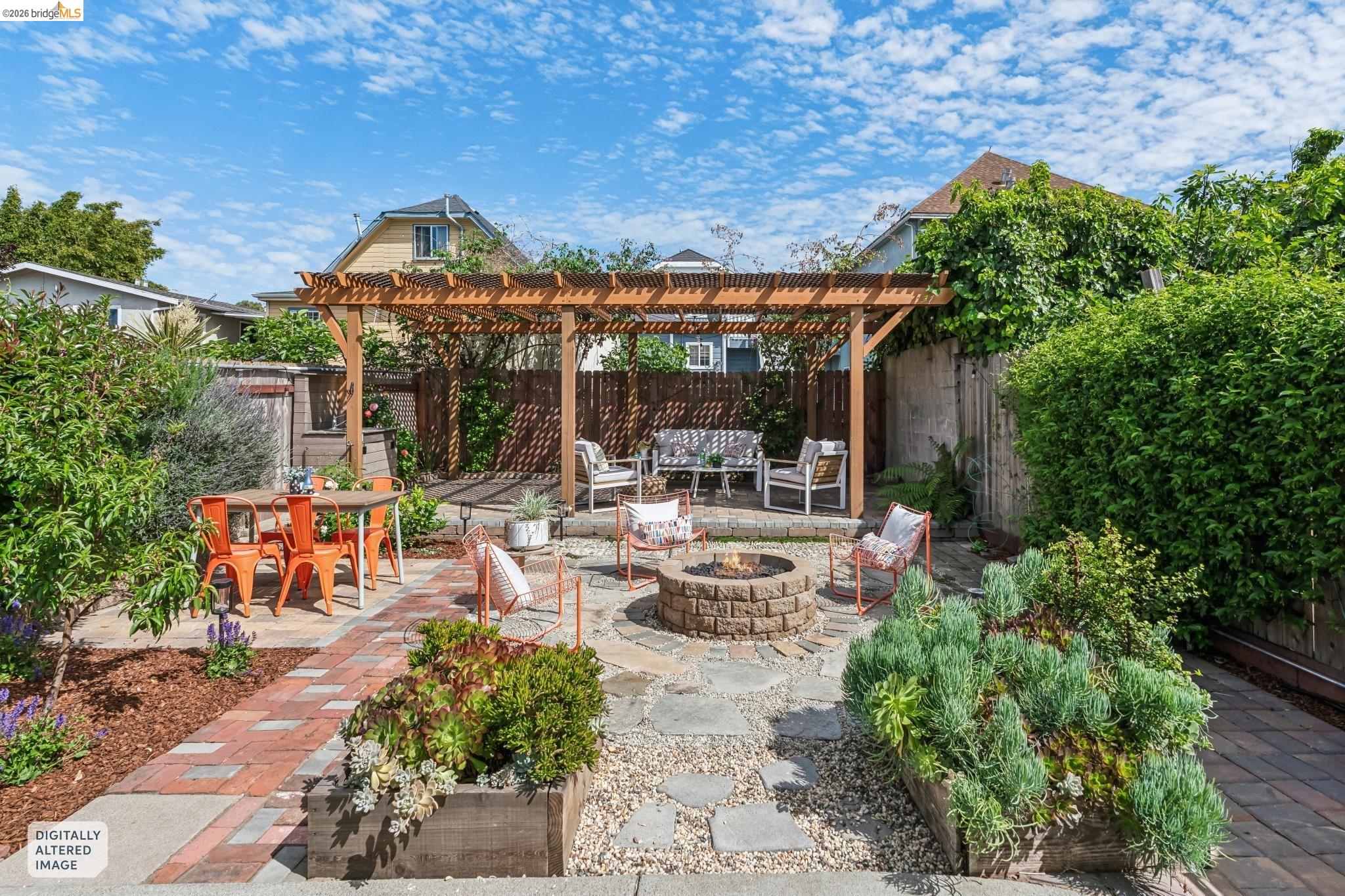 2010 Filbert Street Oakland, CA 94607 - Photo 23 of 50 Fenced backyard featuring a patio, a pergola, and an outdoor living space with a fire pit