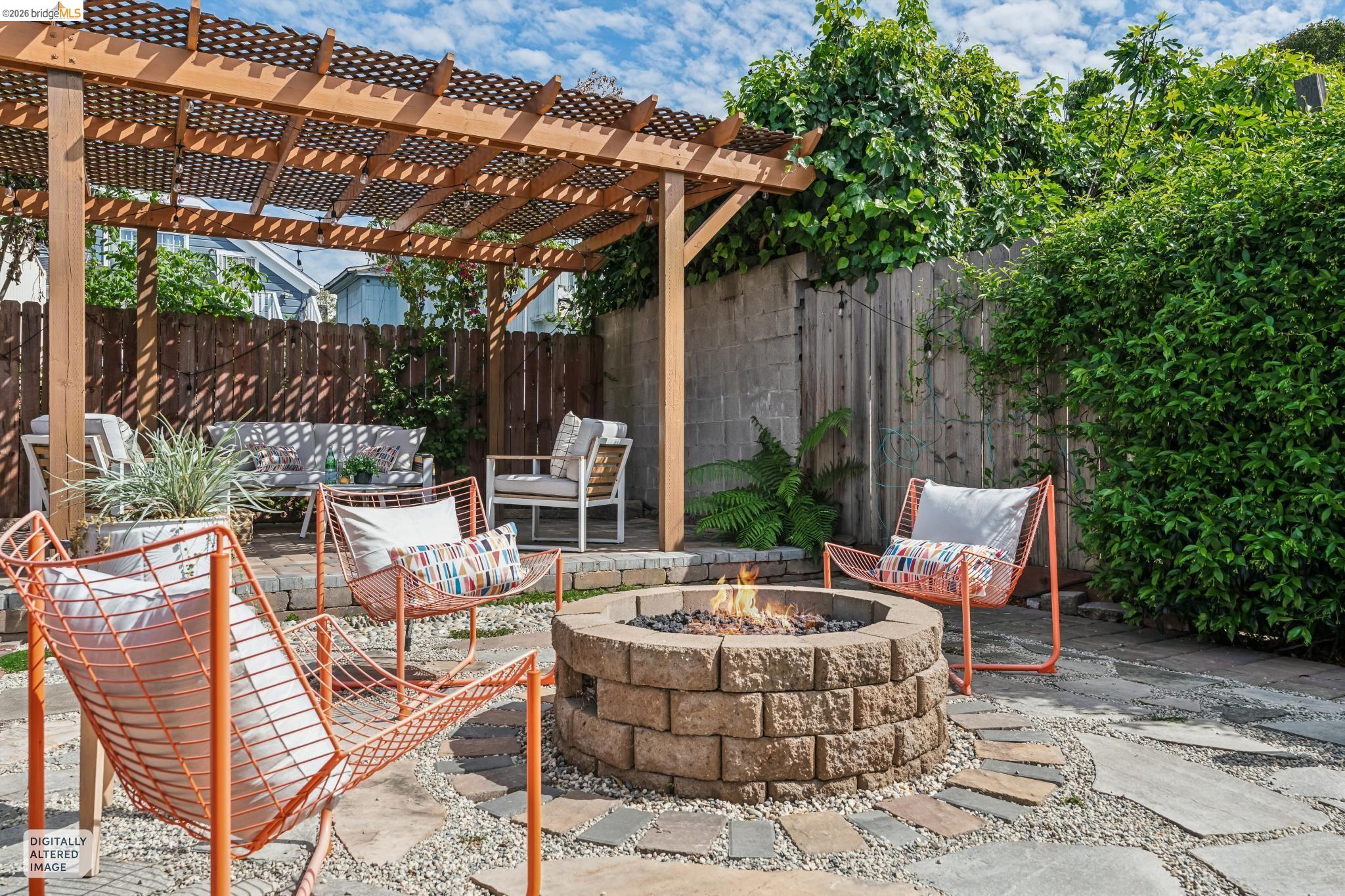 2010 Filbert Street Oakland, CA 94607 - Photo 28 of 50 Fenced backyard featuring a patio area, a pergola, and an outdoor living space with a fire pit