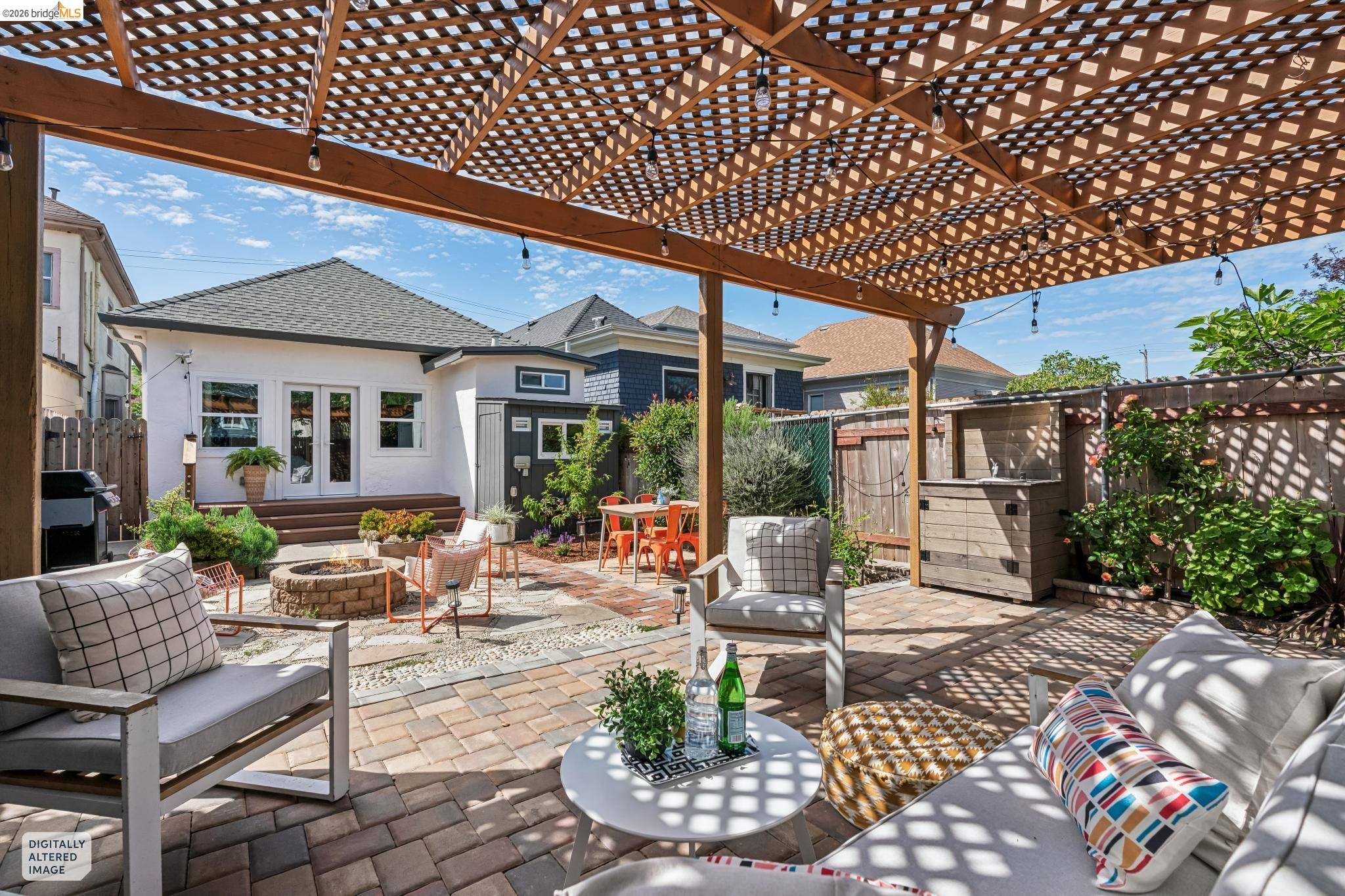 2010 Filbert Street Oakland, CA 94607 - Photo 31 of 50 Fenced backyard featuring a pergola, french doors, a patio, an outdoor fire pit, and an outdoor living / dining area