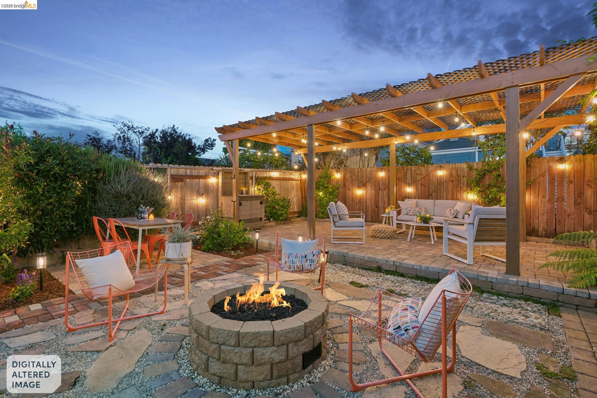 2010 Filbert Street Oakland, CA 94607 - Photo 37 of 50 Fenced backyard with a patio, an outdoor living space with a fire pit, and a pergola