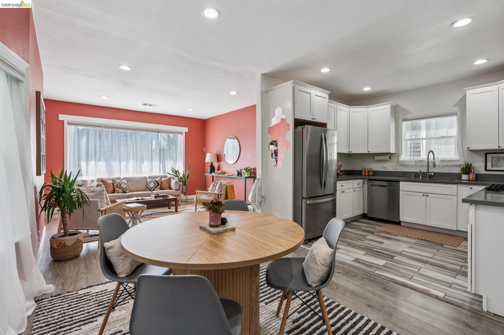 2010 Filbert Street Oakland, CA 94607 - Photo 4 of 50 Kitchen with stainless steel appliances, white cabinets, light wood finished floors, and recessed lighting