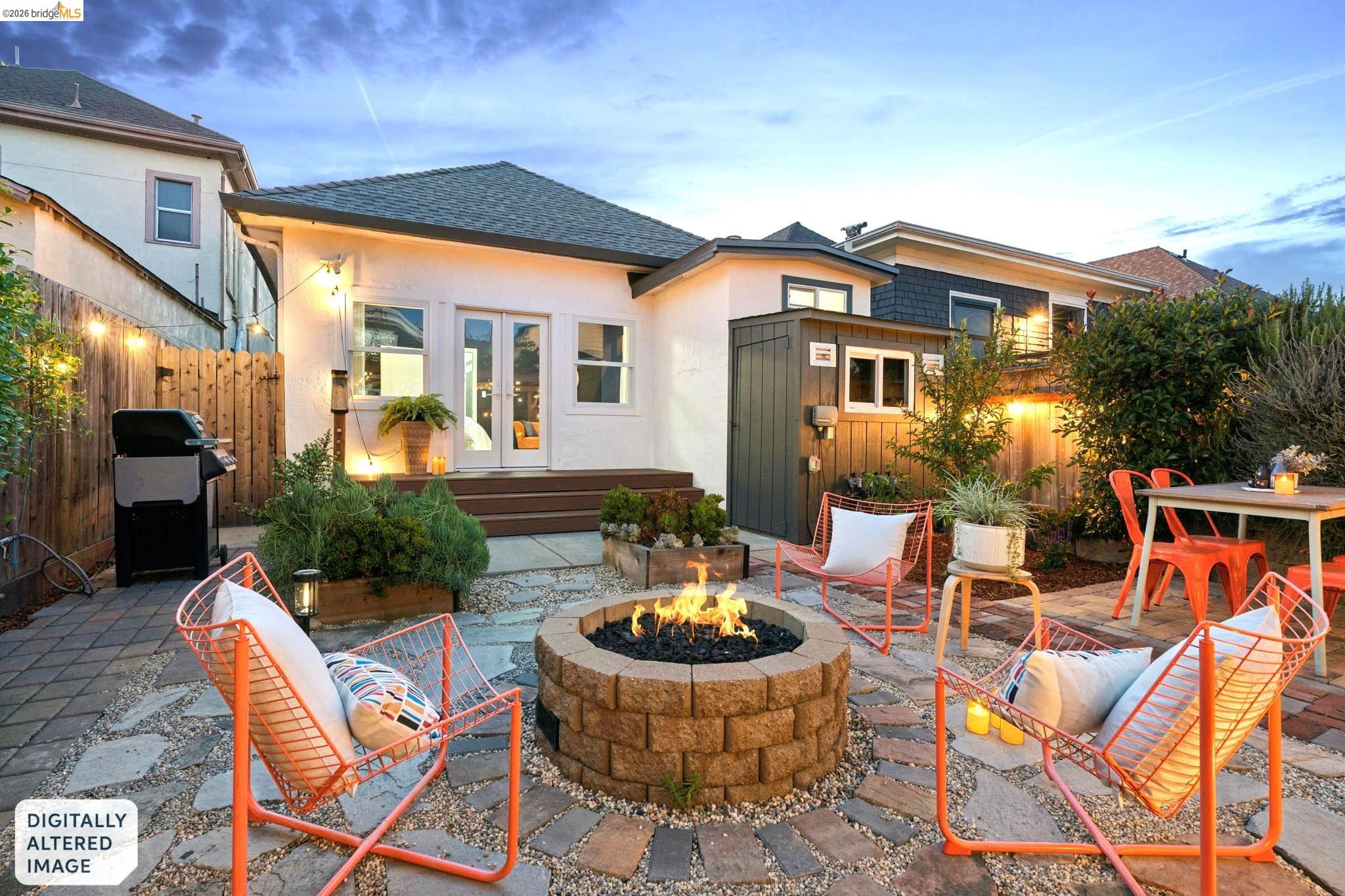 2010 Filbert Street Oakland, CA 94607 - Photo 41 of 50 Back of house featuring a patio, french doors, roof with shingles, stucco siding, and a fire pit