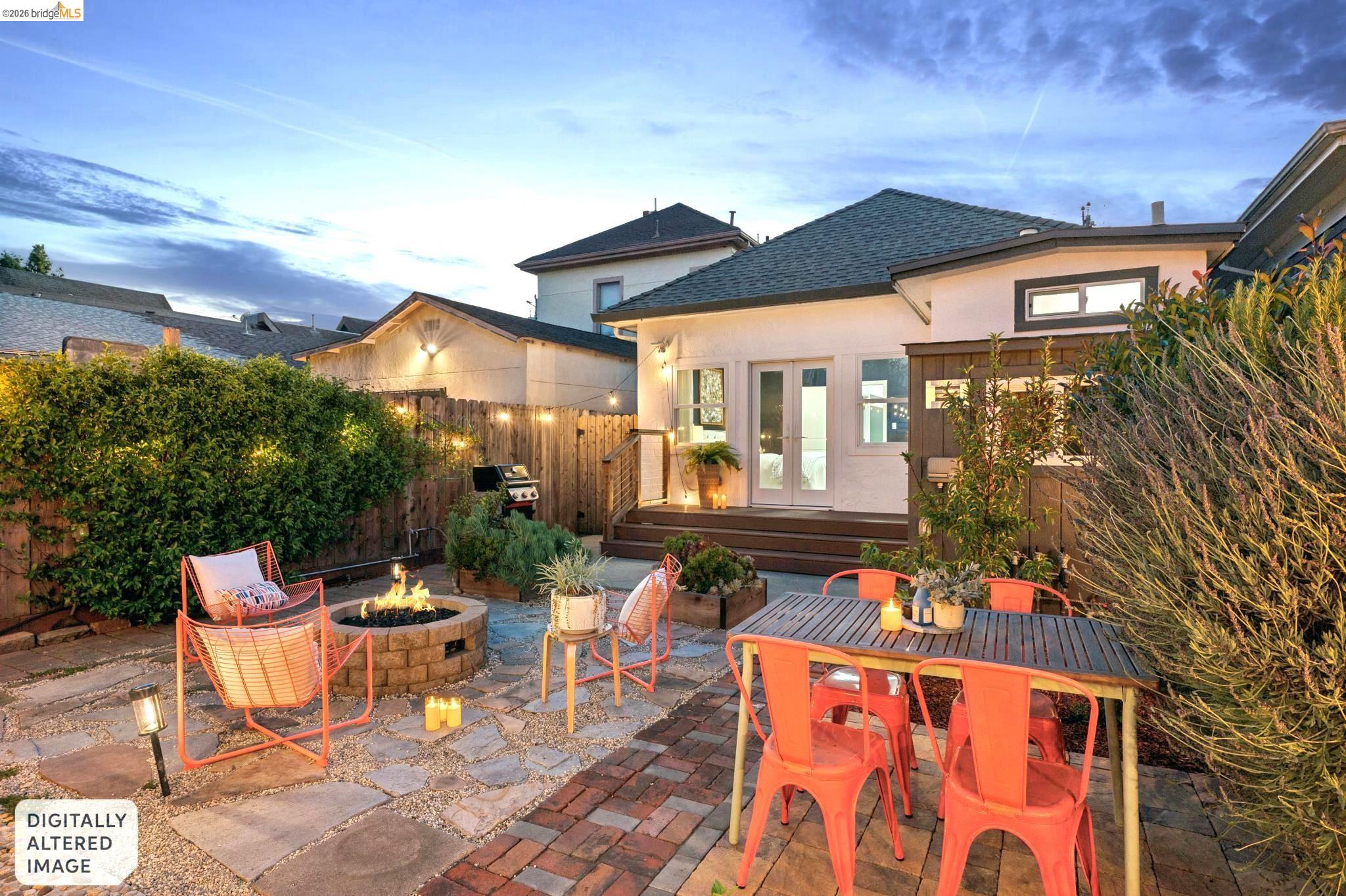 2010 Filbert Street Oakland, CA 94607 - Photo 44 of 50 Fenced backyard featuring a patio area, french doors, a fire pit, and outdoor dining area