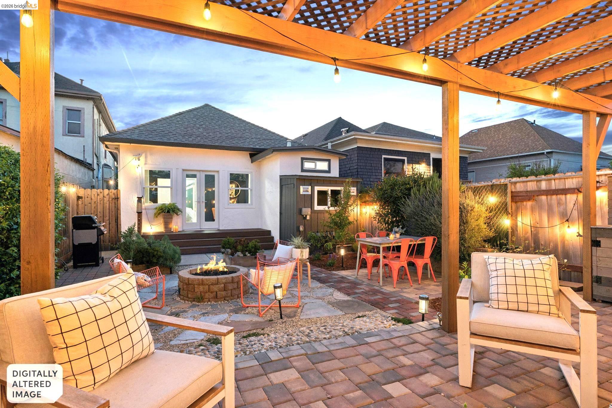 2010 Filbert Street Oakland, CA 94607 - Photo 47 of 50 Patio terrace at dusk featuring a patio, an outdoor fire pit, outdoor dining space, and grilling area