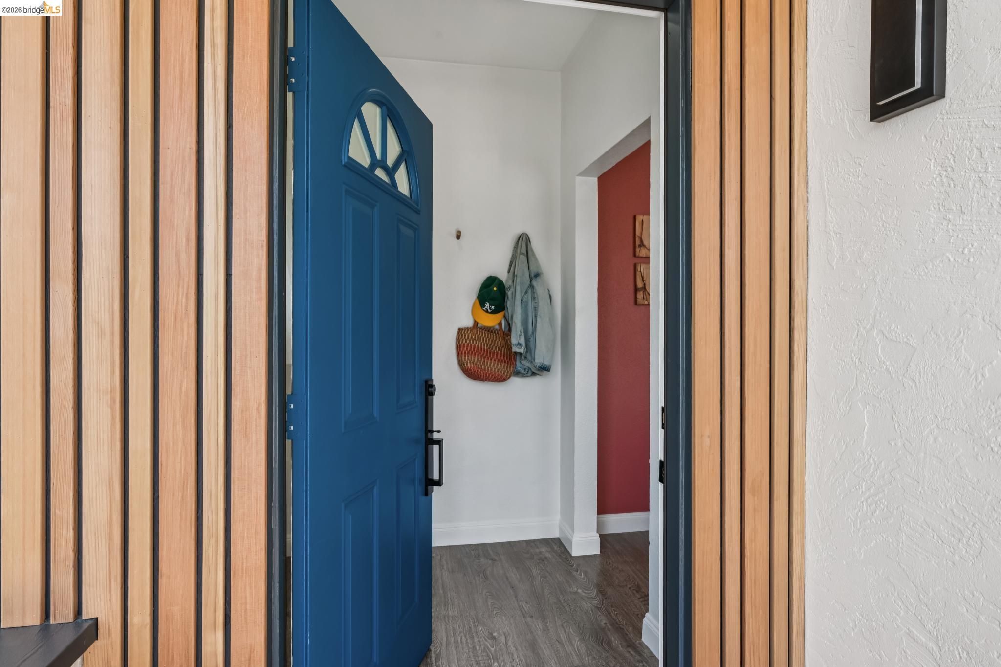 2010 Filbert Street Oakland, CA 94607 - Photo 49 of 50 Entryway featuring dark wood finished floors and a textured wall