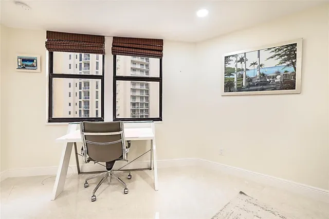 a workspace with furniture and a window