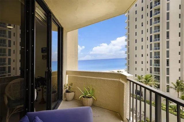 a view of balcony with furniture