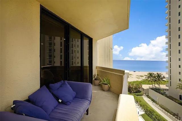 a view of swimming pool from a balcony