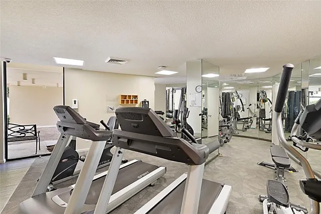a room with gym equipment and view