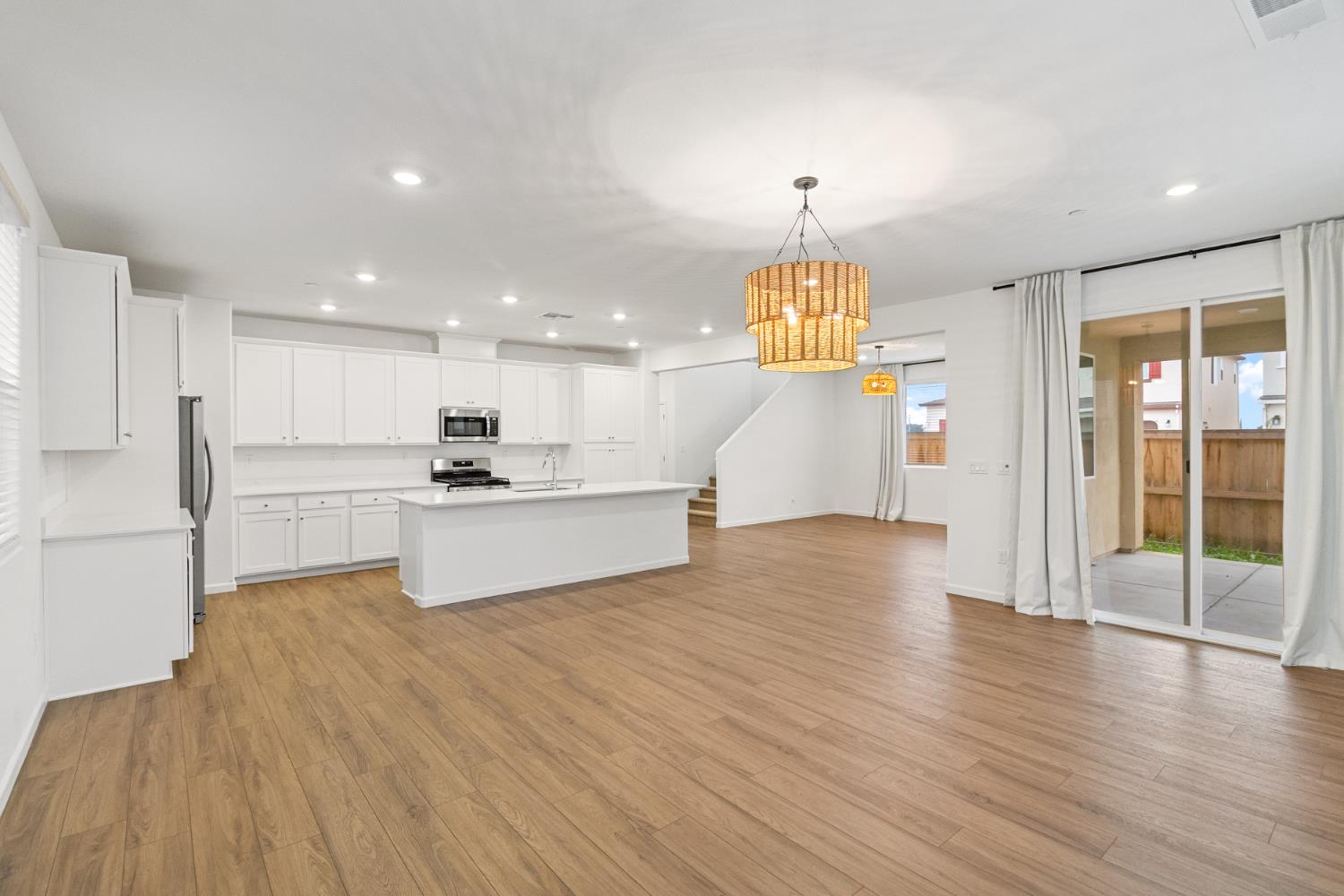 8809 Boes Way Sacramento, CA 95829 - Photo 19 of 40 a view of kitchen with cabinets and wooden floor