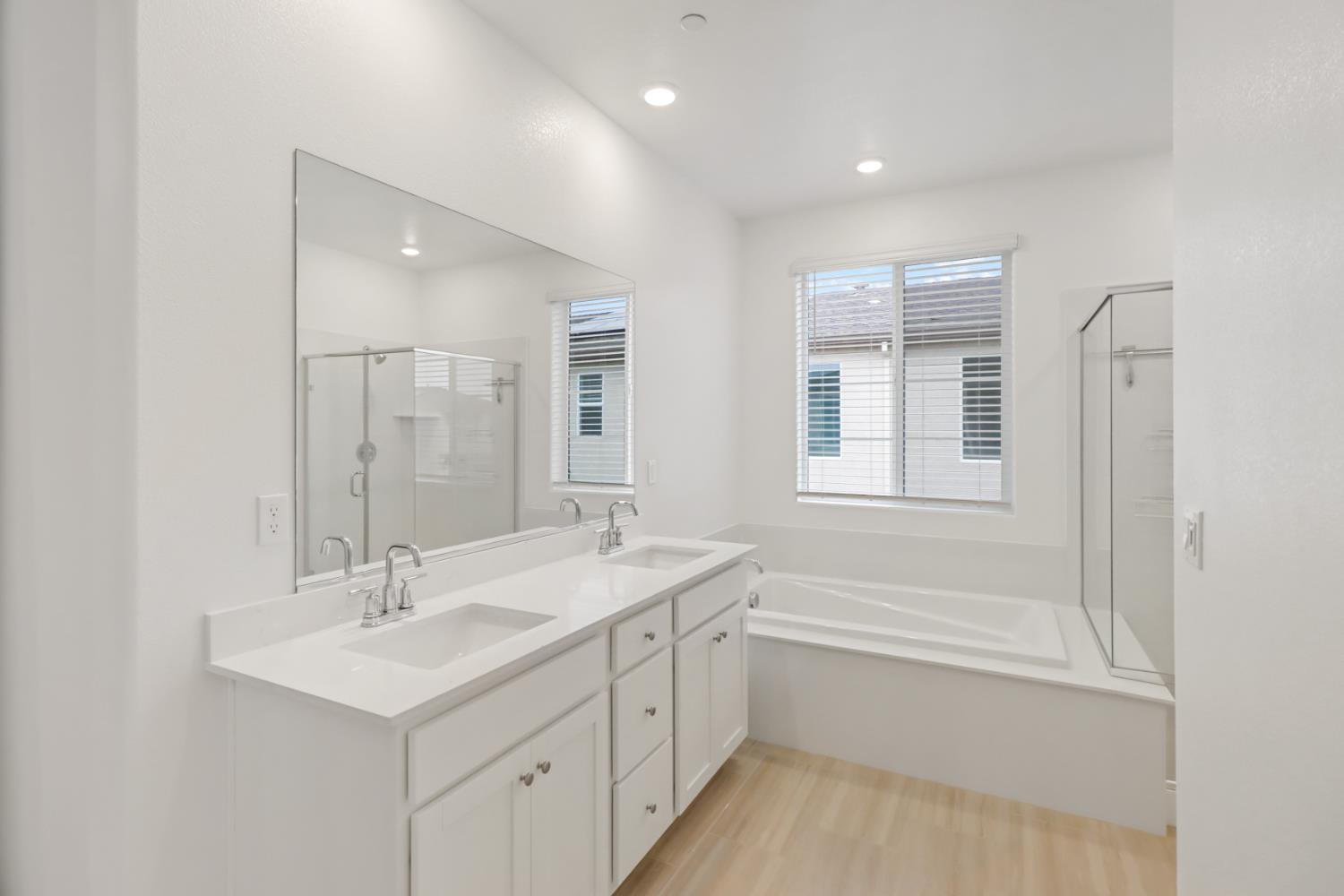 8809 Boes Way Sacramento, CA 95829 - Photo 27 of 40 a bathroom with a sink double vanity granite tub and a mirror
