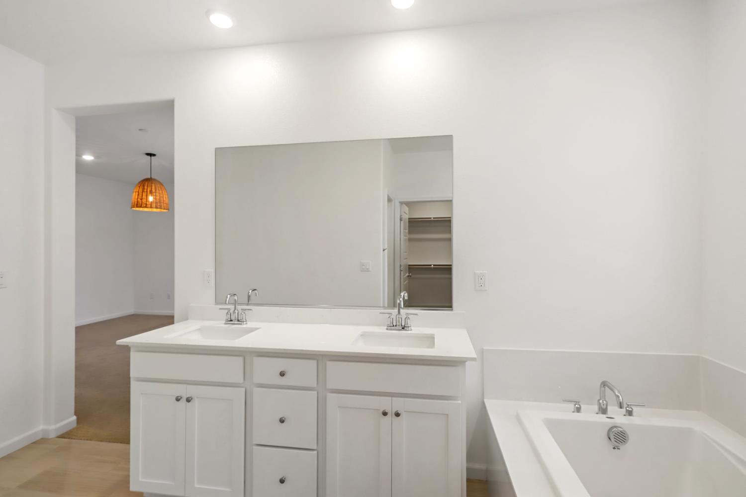 8809 Boes Way Sacramento, CA 95829 - Photo 28 of 40 a bathroom with a sink double vanity and a tub