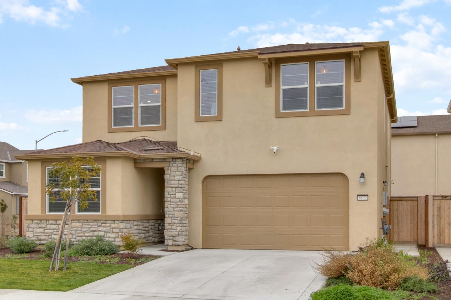 8809 Boes Way Sacramento, CA 95829 - Photo 3 of 40 a front view of a house with garden