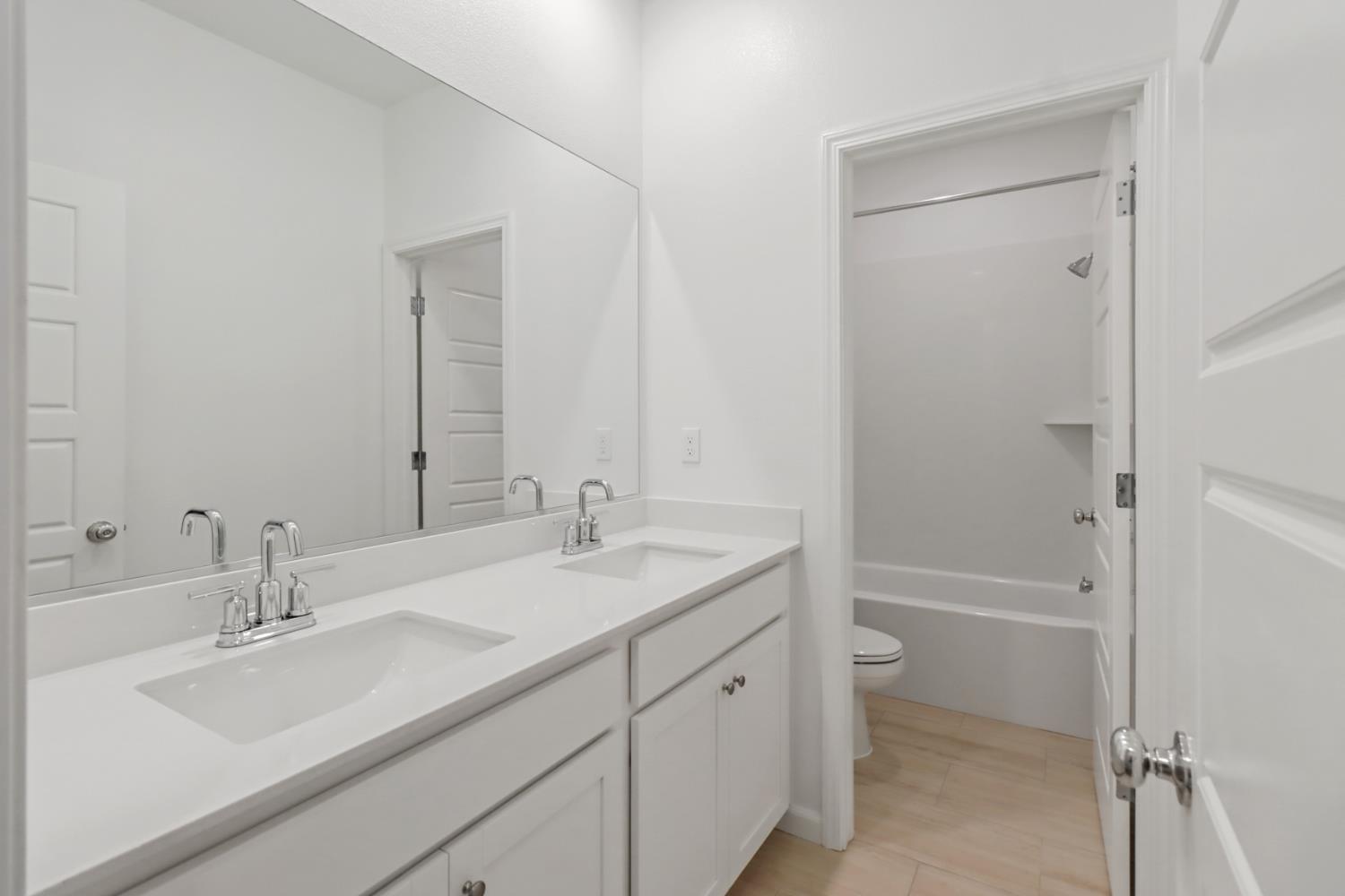 8809 Boes Way Sacramento, CA 95829 - Photo 38 of 40 a bathroom with a sink double vanity granite tub shower and a mirror