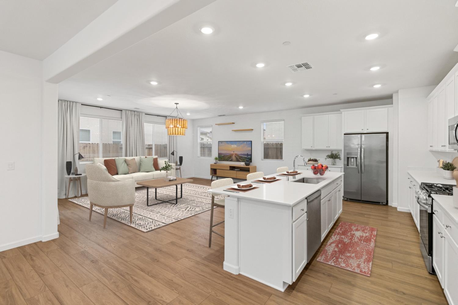 8809 Boes Way Sacramento, CA 95829 - Photo 6 of 40 a living room with furniture and a dining table with wooden floor
