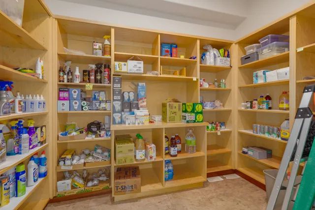a bedroom with a large bed and a large window