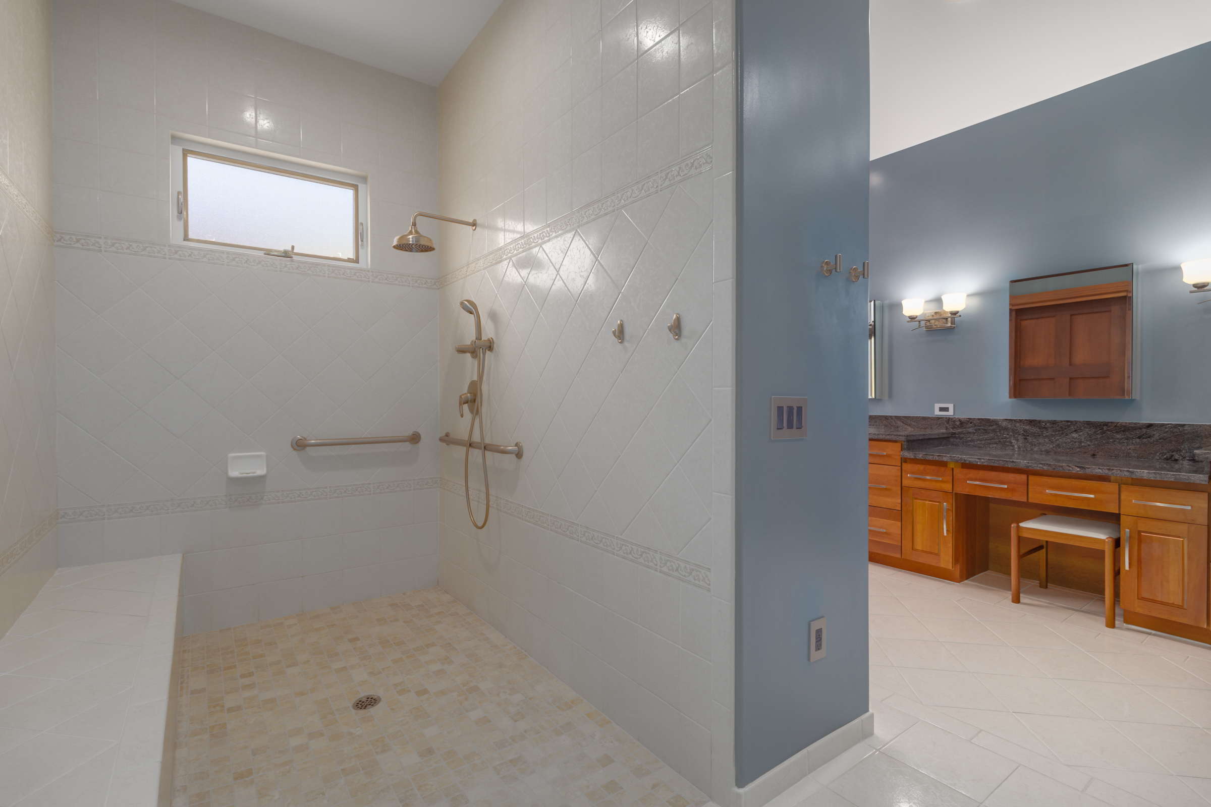 82-1171 Meli Road Captain Cook, HI 96704 - Photo 16 of 29 a bathroom with a sink a light fixture and a glass door shower