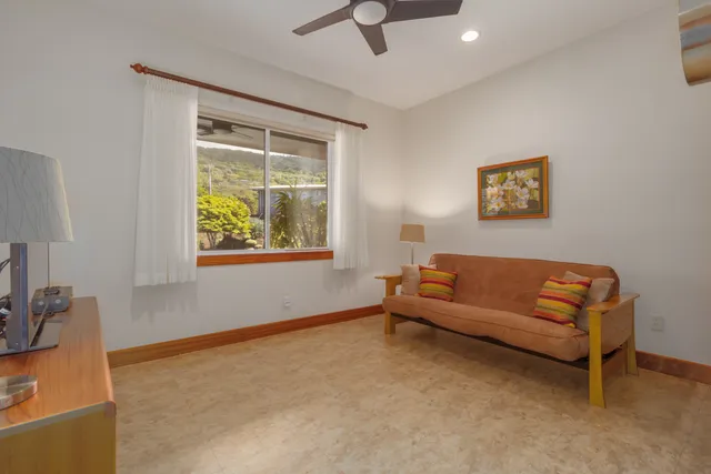 a bathroom with a granite countertop sink a mirror and shower